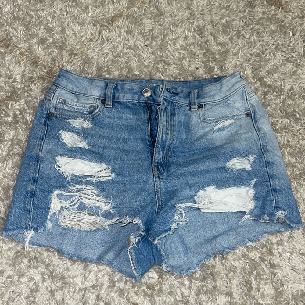 RIPPED Light blue denim washed . American eagle . jean shorts size 8